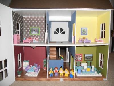 Play Therapy- Dollhouse: Front opened with family miniatures in the middle.
